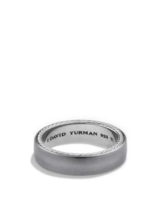 a wedding band with the name david yuman engraved on it in white gold and silver