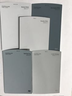 four different shades of gray and white paint