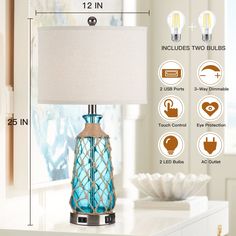 a blue glass table lamp with measurements for the base and fabric shade on it's side