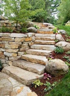 stone steps leading up to a rock wall