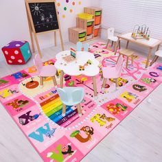 a child's play room with pink rugs and toys