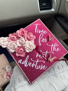 a pink graduation cap decorated with flowers and the words time for the rest of adventure