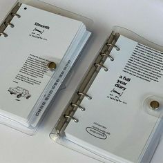 two clear binders on top of each other