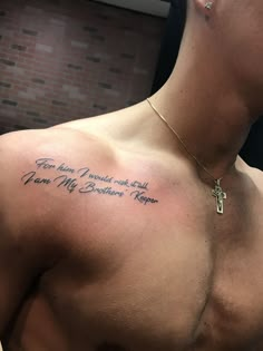 a man with a cross on his chest has a tattoo that reads, you are my brother's keeper