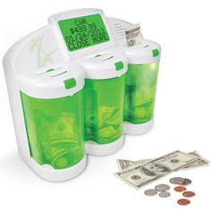 three plastic cups with money in front of them and an electronic timer on the side