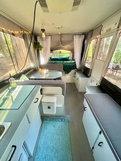 the inside of a camper with lots of windows