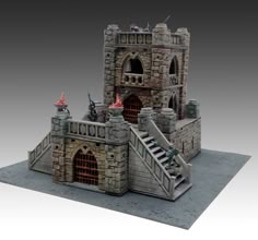 a model of a castle with stairs leading to the door and two turrets on top