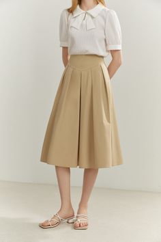 Fabric: 100% Cotton Color: Camel Care: Hand wash or gentle machine wash Mid-rise pure cotton midi skirt. Waistband and elastic design at back. Flared skirt with pleated detail. Splicing Wrap skirt. Regular fit. The skirt design is spun from cotton, making the regular fit midi silhouette a breeze to slip on when looking for that cosy weekend partner. Model is 173cm/5'8" tall and wearing a size M. Summer Pleated Skirt, Beige A-line Summer Skirt, Elegant Cotton A-line Pleated Skirt, Box Pleat Skirt Pattern, Casual Midi-length Pleated Skirt With Lining, 40s Skirt, Beige Lined Midi-length Pleated Skirt, Relaxed Midi-length Pleated Skirt With Lining, Pleated Skirt Pattern