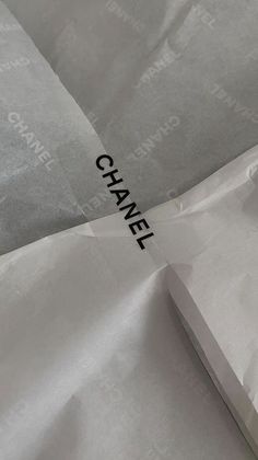 a piece of white paper with the word chanel on it