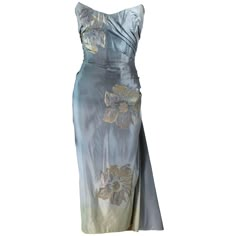 This gown is composed of a gradient silk, which goes from pale blue to light yellow, with a floral pattern. Features a center back closure, with a side drape. There is an interior bustier with boning. In great vintage condition, excellent for design research, there are signs of wear due to age (Such as deteriorated bust cups). **Please cross-reference measurements for personal accuracy. Measures (Approximately) Length:43.5" Bust: 32" Waist: 25" Hip: 32" Yellow Evening Gown, Yellow Vintage Dress, Yellow Drapes, Blue And Yellow Dress, Silk Yellow Dress, Pale Blue Dresses, Gowns Blue, Vintage Dress Blue, Vintage Ball Gowns