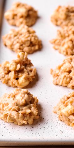 several cookies are on a baking sheet ready to be baked in the oven or used as an appetizer