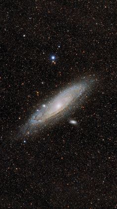 an image of a very large galaxy in the night sky with stars and bright lights