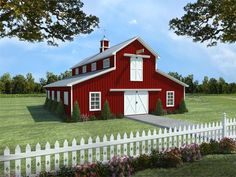 a red barn with a white picket fence