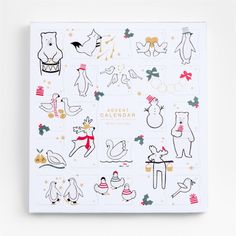 a white calendar with christmas stickers on the front and back of it's cover