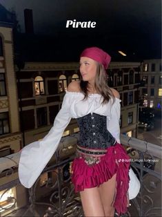 a woman in a pirate costume standing on a balcony with the caption, pirate