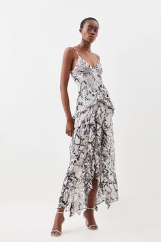 Defined by a sleek snakeskin print, this maxi dress makes an instant statement. Lightweight fabric cascades down the silhouette in dramatic ruffles, adding a romantic touch. Style this piece with strappy heels for an event-ready ensemble.Cami strapsRuffle designSnake printLightweight fabricLeg slitMaxi hemline The Snake, Snakeskin Print, Karen Millen, Fashion Face, Strappy Heels, A Romantic, Lightweight Fabric, Dress Collection, Dress Making