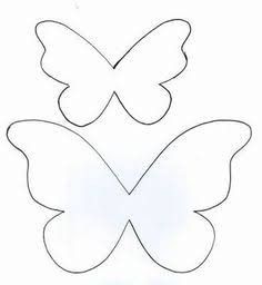 three butterflies cut out from paper on a white background