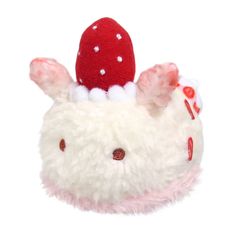 a white stuffed animal with a red hat on top of it's head and ears