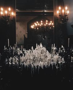 an elaborately decorated room with candles and chandelier