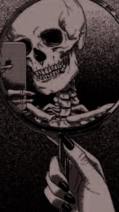 the skeleton is looking at its own reflection in a magnifying glass, with one hand holding a cell phone