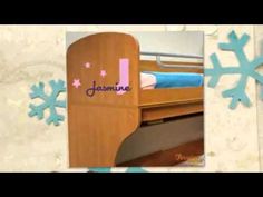 a snowflake with the name jammee on it next to a bunk bed