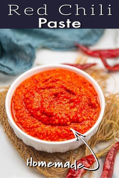 red chilli paste in a white bowl with text overlay that reads homemade chili paste