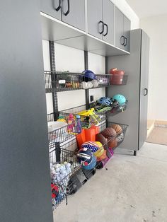 there are many items on the shelves in this garage storage area that is organized with wire baskets and bins