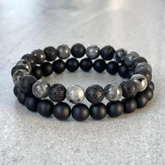 Men's beaded bracelet made with strong, stretchy cord and genuine/natural gemstones. Features ~ 6mm, 8mm or 10mm matte onyx beads ~ 6mm, 8mm or 10mm black lava beads ~ 6mm, 8mm or 10mm larvikite beads ~ Stretchy cord; simply slide bracelet on and off wrist ~ Comes packaged in a re-usable microfiber pouch To ensure the perfect fit, please use the bracelet sizing instructions found in the photo gallery. Lava - Lava Stone is a grounding stone that strengthens one's connection to Mother Earth. It gi Slide Bracelet, Onyx Bracelet, Bracelet Gemstone, Protection Stones, Gemstone Beaded Bracelets, Mens Beaded Bracelets, Lava Bead, Onyx Bead, Lava Stone