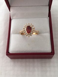 Free Shipping on orders over $35.00 however if there is a return buyer to refund seller for the free shipping cost to seller. Rare 18K Gold 0.75ct Rhodocrosite Gemstone Pear Cut 16 Accent Diamonds Solid 750 Yellow Gold Ring Stunning Beautiful 18K Gold Hallmarked 18K Ring size - 5.75 Visit our shops on Etsy HauteCoutureLaLa TrendsCouture BeautifulPatina LastingTrendsFree Shipping on orders over $35.00 however if there is a return buyer to refund seller for the free shipping cost to seller. Free S Pear-shaped Birthstone Ring For Formal Occasions, Gold Pear-shaped Cluster Ring Gift, Pear-shaped Yellow Gold Cluster Ring For Gift, Formal Pear Shaped Birthstone Ring, Gold Ruby Ring With Pear-shaped Gemstone, Pear-shaped Yellow Gold Ruby Ring, Gold Pear-shaped Ruby Ring, Pear-shaped Birthstone Ring For Gift, Retro Ring