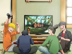 three people sitting in front of a tv with one person holding up his hand and the other