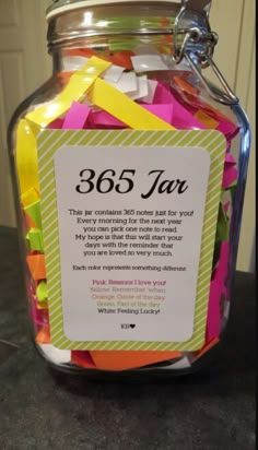 a jar filled with lots of different colored confetti and some sort of label