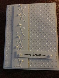 a close up of a greeting card with pearls on the edges and words alcoup