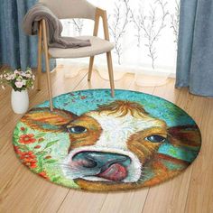 a rug with a cow's face painted on it in front of a chair