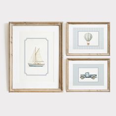 three framed pictures with boats and hot air balloons on them, one in blue and the other in white