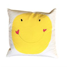 a pillow with a smiley face drawn on the front and back of it's sides