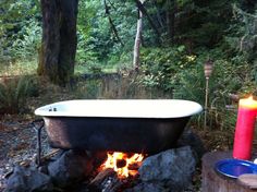 a bath tub sitting on top of a fire pit