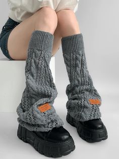 Elevate your winter wardrobe with our Gray/Black/Milk White Knit Flared Leg Warmers. Crafted from high-quality, soft knit fabric, these leg warmers are designed to provide both warmth and style. The flared design adds a touch of elegance and a retro flair, making them a perfect accessory for any outfit. Available in versatile colors of gray, black, and milk white, these leg warmers can easily be paired with skirts, dresses, or even over jeans for a chic layered look. Garment Size SizeFree SizeFu Solid Cotton Leg Warmers For Fall, Black Non-stretch Winter Sweater, Winter Cotton Black Leg Warmers, Black Cotton Leg Warmers For Winter, Black Cotton Leg Warmers For Fall, Black Cotton Casual Leg Warmers, Casual Black Cotton Leg Warmers, Comfortable Fall Leg Warmers, Soft Comfortable Leg Warmers For Winter