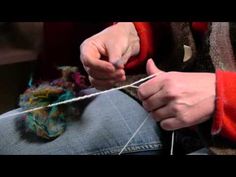 a person is knitting yarn on a string