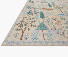 a rug with trees and animals on it