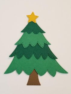 a felt christmas tree with a star on top