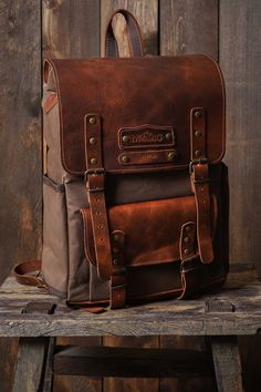 HIKI BAG*LAPTOP BACKPACK*HİKİNG BAG*BİRTHDAY GİFT*BOYFRIEND GİFT * Made of waterproof fabric and genuine leather. * Size: 17,3 H x 10,6 L x 4,3 W / 44x 27x 11cm * There are special drinkers for thermos and flask on the side of the bag. * The leather cover gives the bag an elegant look and increases its durability. *The canvas fabric, which is waxed with beeswax and paraffin to make it waterproof, creates patterns when folded and offers a rich look. * You can use and personalize this bag with con Rectangular Leather Backpack With Leather Trim For Travel, Rectangular Leather Trim Backpack For Travel, Rectangular Leather Backpack For Travel, Rectangular Backpack With Leather Backing For Everyday Carry, Rectangular Coated Canvas Leather Backpack For Travel, Rectangular Leather-backed Backpack For Everyday Carry, Rectangular Leather-backed Everyday Backpack, Everyday Carry Standard Backpack With Leather Trim, Brown Leather Backpack With Leather Trim For Everyday Carry