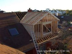 a house being built on top of a roof