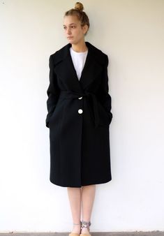 "Absolutely gorgeous vintage 90s Dolce & Gabbana wool coat in black Super classy, three round front silver buttons and three on each arm sleeve marked D&G, side pockets, belt attached, fully Lined in black satin. aside from minor signs of wear Excellent vintage condition. Marked D&G Made in Italy. ** Model is 5'7\" and size S ** / bust: 33\" / waist: 26\" / hips: 37\" Tag size: 46 Approximate size S/M please refer to the Measurements Measurements: taken while lying flat, double where Mode Mantel, Kimono Maxi Dress, Long Midi, Black Wool Coat, Women Coat, Coat Vintage, Embroidered Jacket, Coat Fashion, Dolce & Gabbana