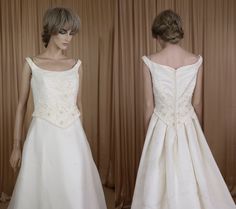 the back of a white wedding dress on display