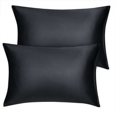 two black pillows sitting next to each other