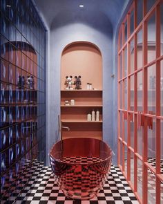 a bath room with a large tub and shelves