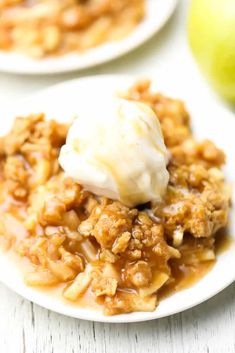 an apple crisp on a plate with ice cream