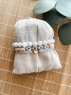 Custom neutral bracelet stack This bracelet stack is super cute and trendy. You are able to choose the word that you want and make it personal. Such a cute expression of faith. Please choose the color for the word bracelet. If you need a size other than 7 please leave that in the box too. The average size for a female is 7 inches. To measure your wrist: *Take a piece of yarn and measure around your wrist with the yarn and then measure the yarn in inches to get your wrist measurement. These are d Inspirational Adjustable Stretch Bracelet, Inspirational Adjustable Stretch Bracelet For Everyday, Adjustable Stacked Bracelets As Gift, Trendy Stackable Charm Bracelet Gift, Inspirational Handmade Bracelets For Everyday, Meaningful White Adjustable Beaded Bracelets, Inspirational Handmade Bracelet For Everyday, Trendy White Charm Bracelet With Round Beads, Handmade White Beaded Bracelets With Meaningful Style