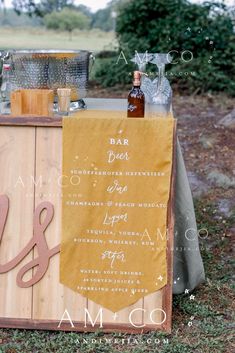 an outdoor bar set up with drinks and menus