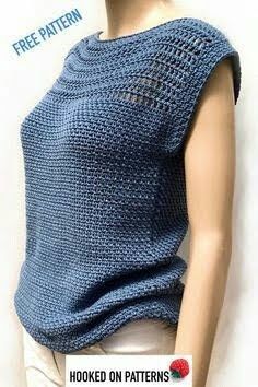 a mannequin wearing a blue knitted top